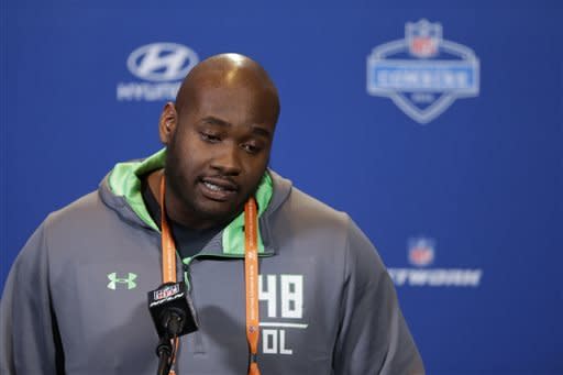 FILE - In this Feb. 24, 2016 file photo, Mississippi offensive lineman Laremy Tunsil speaks during a press conference at the NFL football scouting combine in Indianapolis. Former Mississippi left tackle Laremy Tunsil had a good chance to be the NFL draft's No. 1 overall pick less than two weeks ago when the Tennessee Titans had the pick. Then the Los Angeles Rams traded up for the No. 1 pick in search of a quarterback. Now Tunsil's future is much more uncertain.  (AP Photo/Michael Conroy, File)