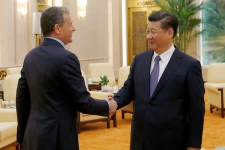 China's President Xi Jinping (R) talks with Chief Executive Officer of Disney Bob Iger as they meet at the Great Hall of the People in Beijing, China, May 5, 2016. REUTERS/Kim Kyung-Hoon