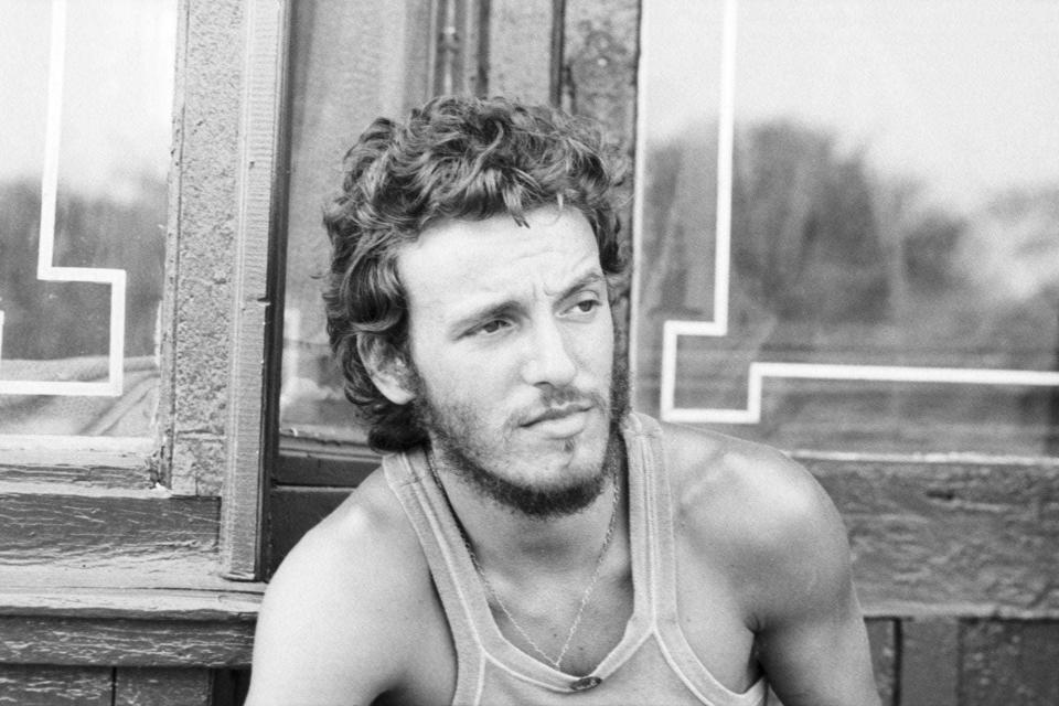 Bruce Springsteen with his eyes on the waves in the early '70s.