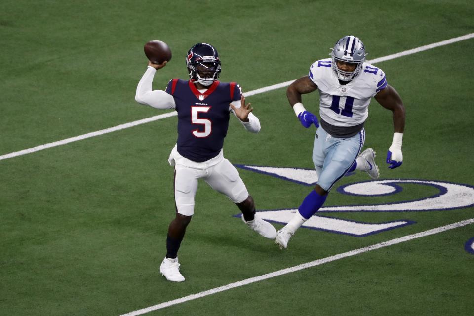 Houston Texans quarterback Tyrod Taylor (5) throws a pass in the first half of a preseason NFL football game under pressure from Dallas Cowboys linebacker Micah Parsons (11) in Arlington, Texas, Saturday, Aug. 21, 2021. (AP Photo/Roger Steinman)