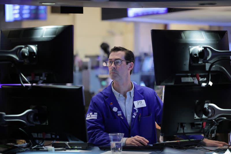 A trader works on the trading floor at the New York Stock Exchange (NYSE) in New York City