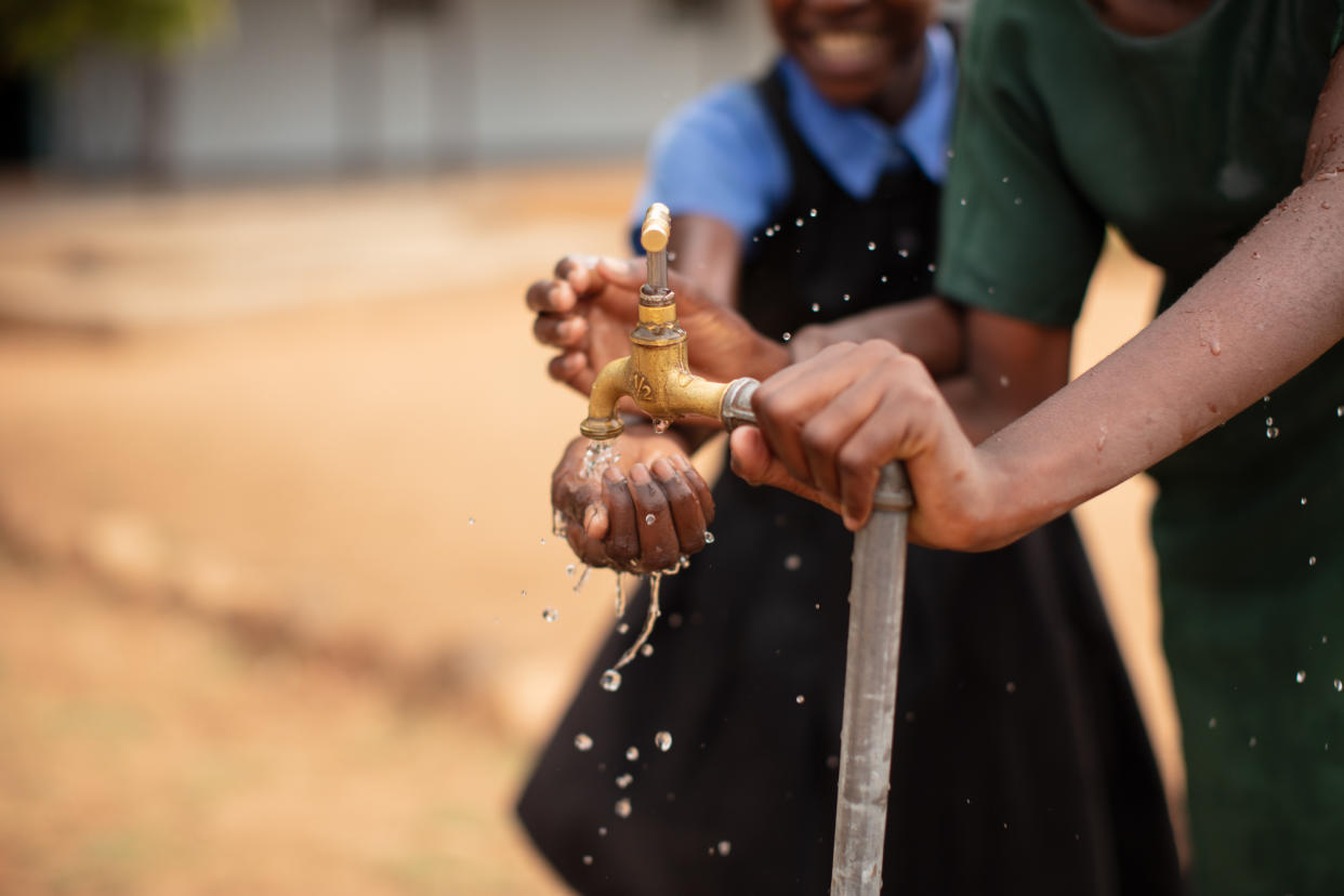 Students in the Kazungula district of Zambia use their school water tap (WaterAid/Laura Pannack/PA)