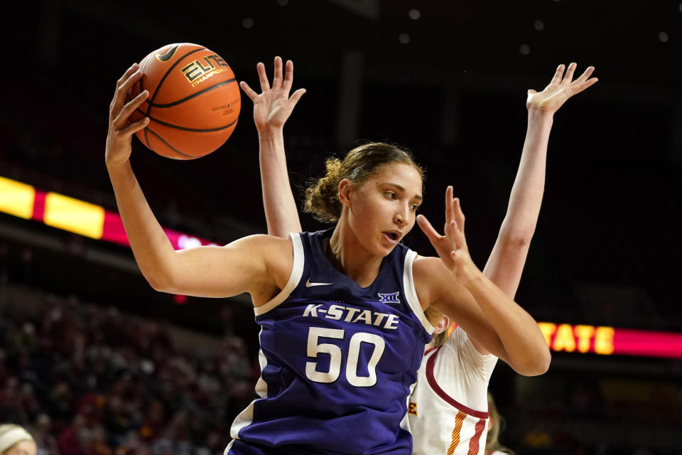 Kansas State center Ayoka Lee (50) grabs a rebound during the second half of an NCAA college basketball game against Iowa State, Wednesday, Feb. 2, 2022, in Ames, Iowa. (AP Photo/Charlie Neibergall)