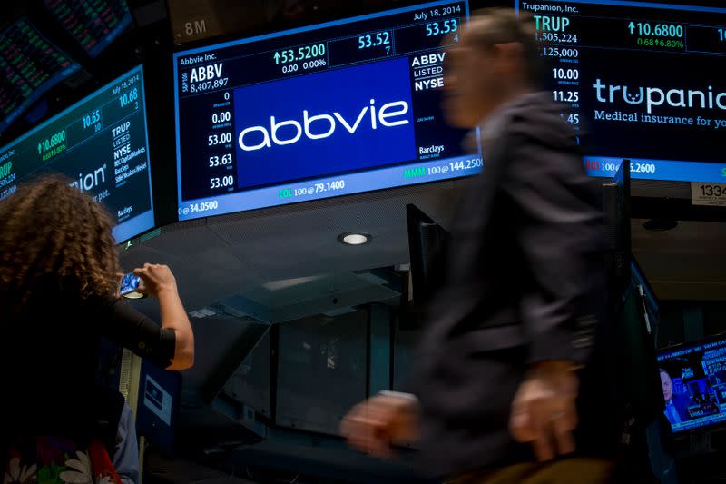 A screen displays the share price for pharmaceutical maker AbbVie on the floor of the New York Stock Exchange