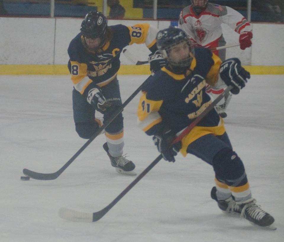 Isaac Hopp (88) plays the puck forward during a high school hockey matchup between Gaylord and Grosse Ile on Friday, December 9 during the Division 3 Showcase in Gaylord, Mich.