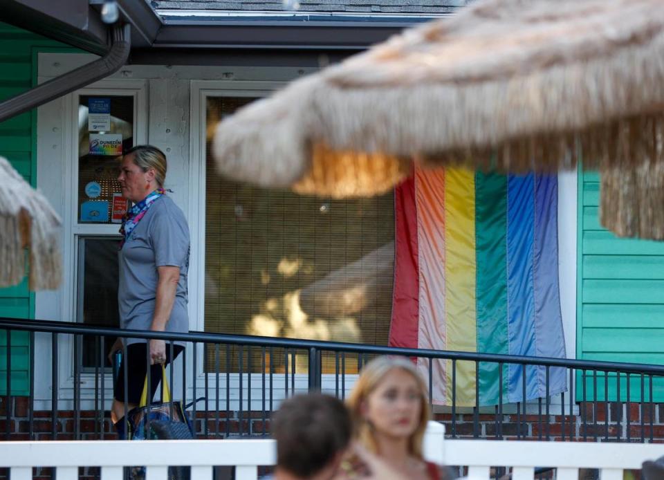 A pride flag is seen on the wall outside of The Honu on Thursday, April 20, 2023 in Dunedin. Owner Kimberly Platt is one of the organizers of this year’s Dunedin Pride event.