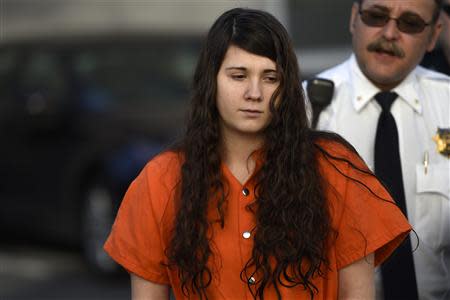 Miranda Barbour, 19, the woman dubbed the so-called Craigslist killer suspect, is led into court by sheriff deputies in Sudbury, Pennsylvania April 1, 2014. REUTERS/Mark Makela