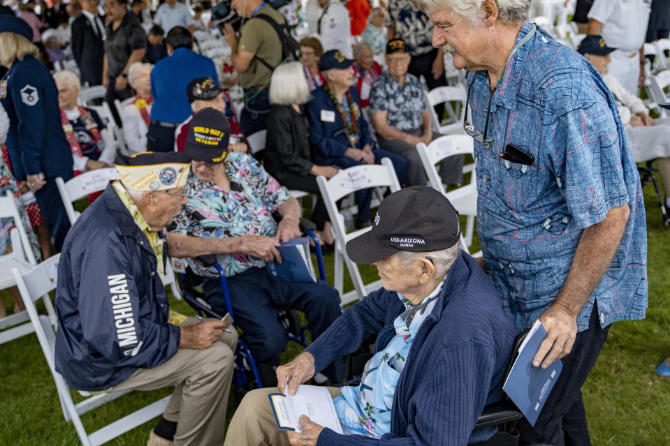 Robert Lee, 103, enters the 82nd Pearl Harbor Remembrance Day ceremony on Thursday, Dec. 7, 2023, at Pearl Harbor in Honolulu, Hawaii. Pearl Harbor Survivors, World War II veterans and their families gather in Pearl Harbor to commemorate those who perished 82 years ago. (AP Photo/Mengshin Lin)