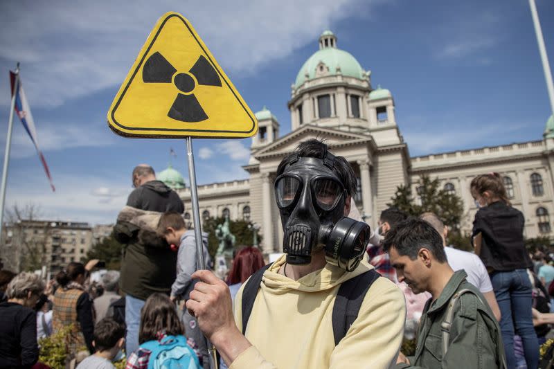 People attend a protest in front of the Serbian parliament in Belgrade