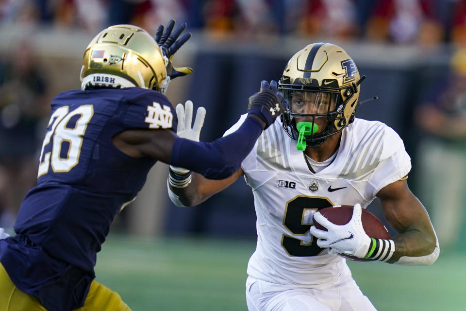 Purdue wide receiver Mershawn Rice (9) tries to get past Notre Dame cornerback TaRiq Bracy (28) during the second half of an NCAA college football game in South Bend, Ind., Saturday, Sept. 18, 2021. Notre Dame defeated Purdue 27-13. (AP Photo/Michael Conroy)