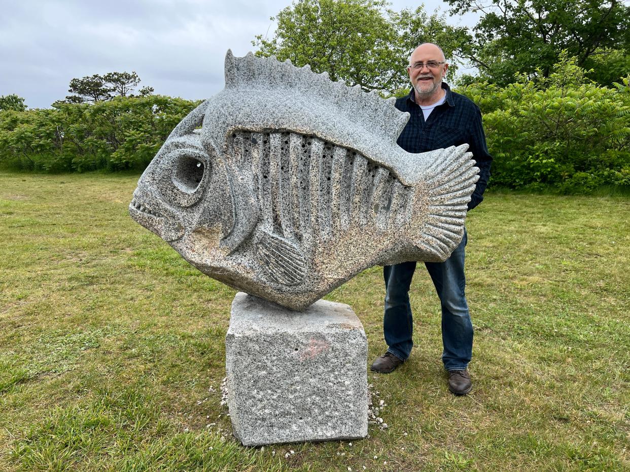 Kittery artist Thomas Berger stands by Rotten Fish, one of the large stone sculptures in the Flow of Life exhibition on display at Seacoast Science Center through Sept. 4. All pieces are available for purchase with a portion of the proceeds to benefit Seacoast Science Center.