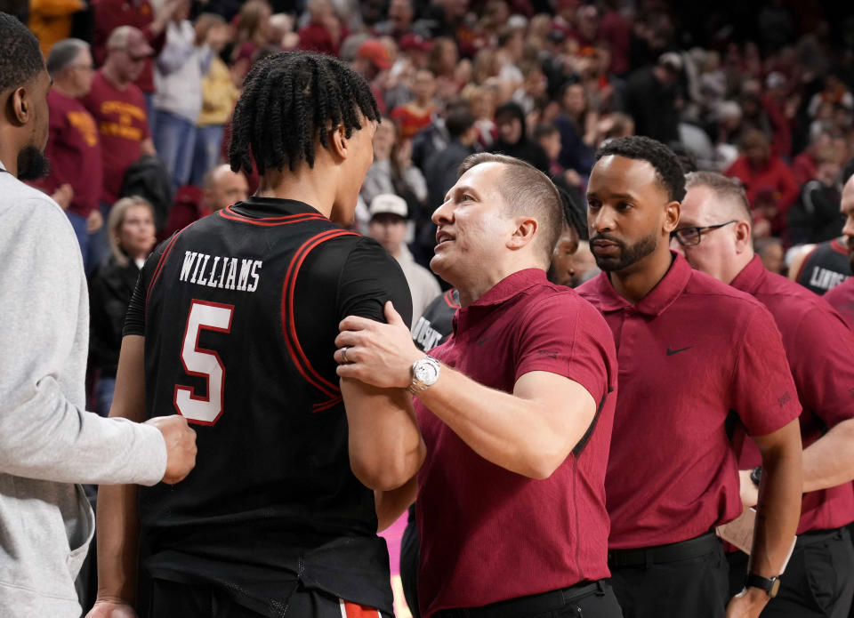 Iowa State head coach T.J. Otzelberger shakes hands with Texas Tech guard Darrion Williams after Iowa State's win in an NCAA college basketball game, Saturday, Feb. 17, 2024, in Ames, Iowa. (AP Photo/Bryon Houlgrave)