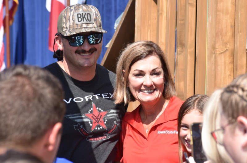 Iowa Gov. Kim Reynolds poses for a photo at the Iowa State Fair in Des Moines on Thursday. Photo by Joe Fisher/UPI