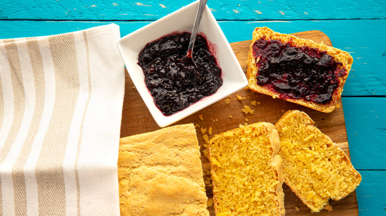 sliced cornbread with berry jam