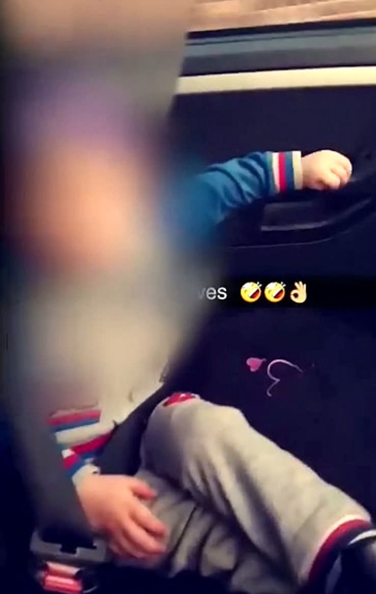 The boy was filmed dancing in the front passenger seat (Picture: SWNS)