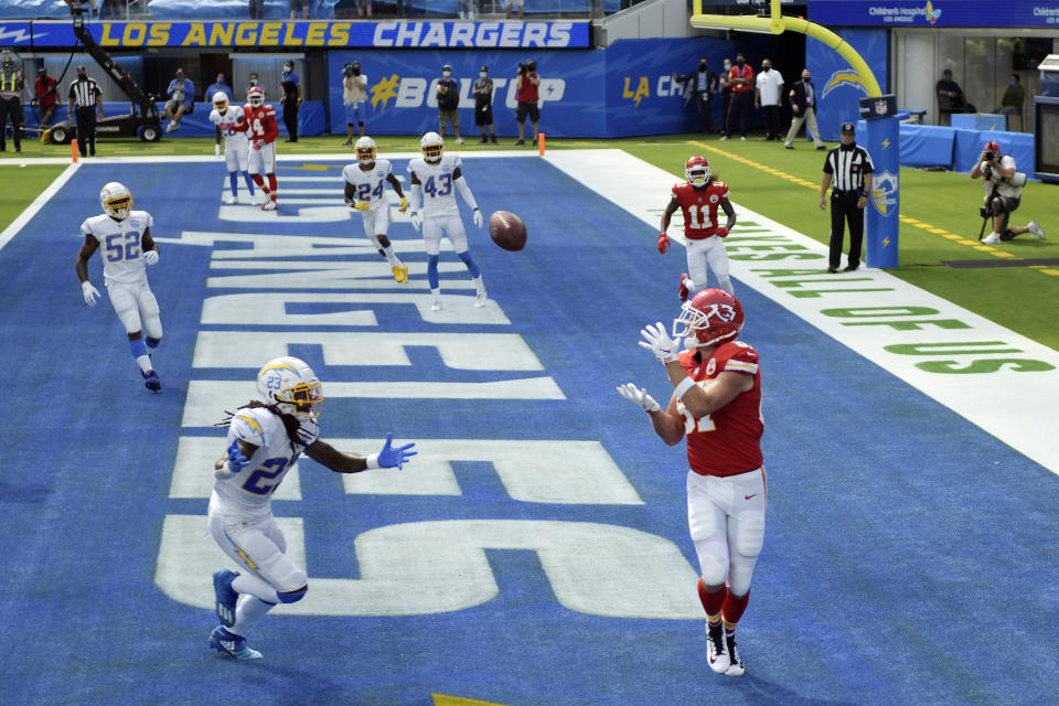 Kansas City Chiefs tight end Travis Kelce, right, makes a touchdown catch in front of Kansas City Chiefs safety Rayshawn Jenkins, bottom left, during the first half of an NFL football game Sunday, Sept. 20, 2020, in Inglewood, Calif. (AP Photo/Kyusung Gong)