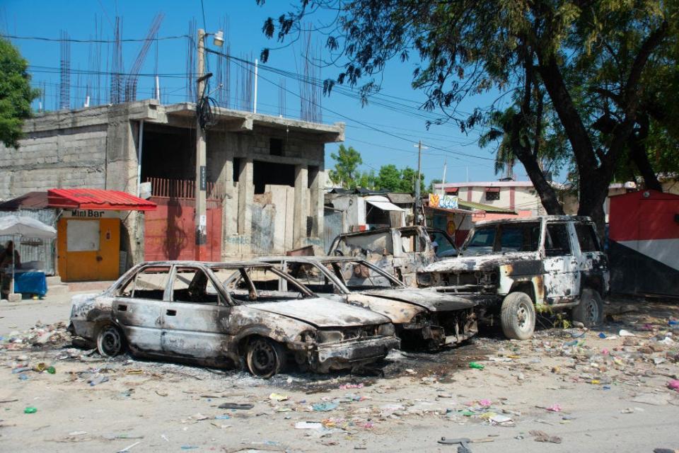 Charred vehicles remain parked as gang violence escalates in Port-au-Prince, Haiti, on March 9.