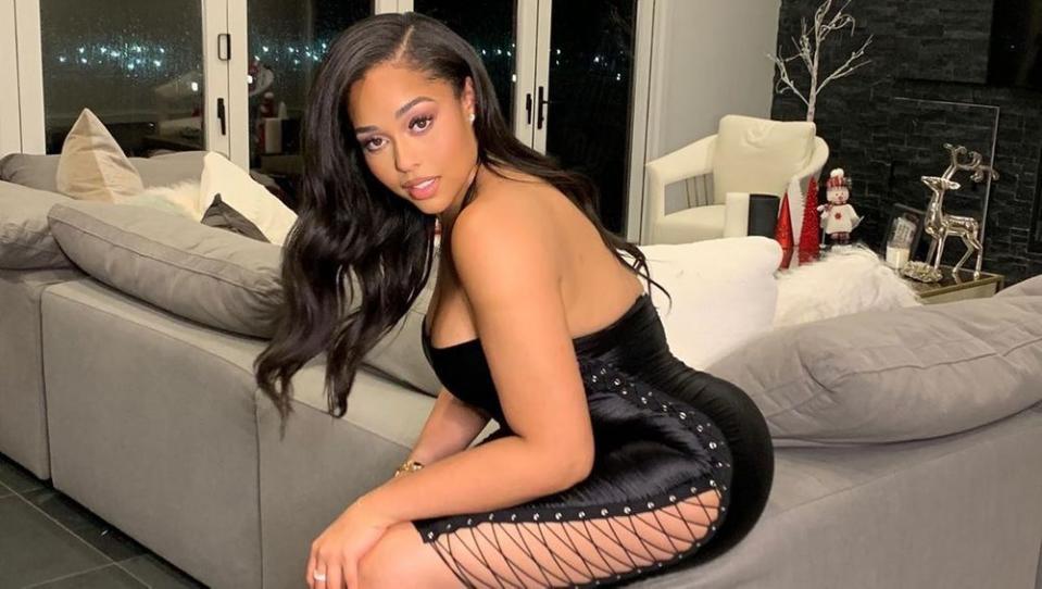 Jordyn Woods poses in a dress