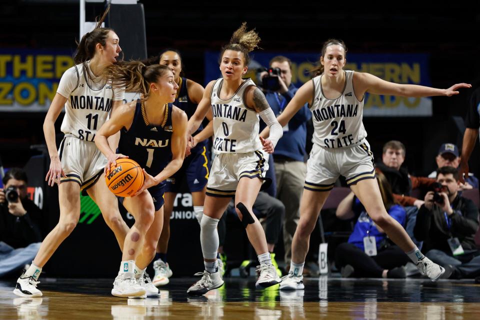 Northern Arizona guard Regan Schenck (1) looks for a pass around Montana State during an NCAA college basketball game in the championship of the Big Sky Conference in Boise, Idaho, Friday, March 11, 2022. (AP Photo/Otto Kitsinger)