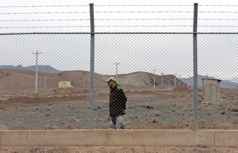 FILE PHOTO: Iranian soldier stands guard inside Natanz uranium enrichment facility