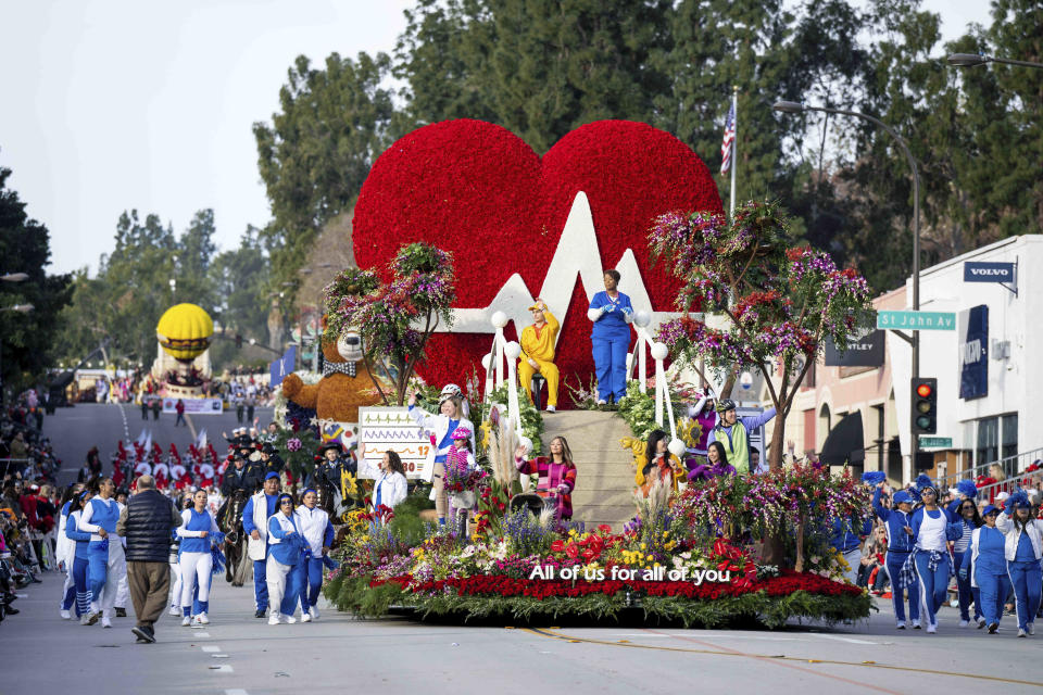 Kaiser Permanente's float, "All of Us for All of You," makes its way along Colorado Boulevard during the 134th Rose Parade in Pasadena, Calif., Monday, Jan. 2, 2023. (Sarah Reingewirtz/The Orange County Register via AP)