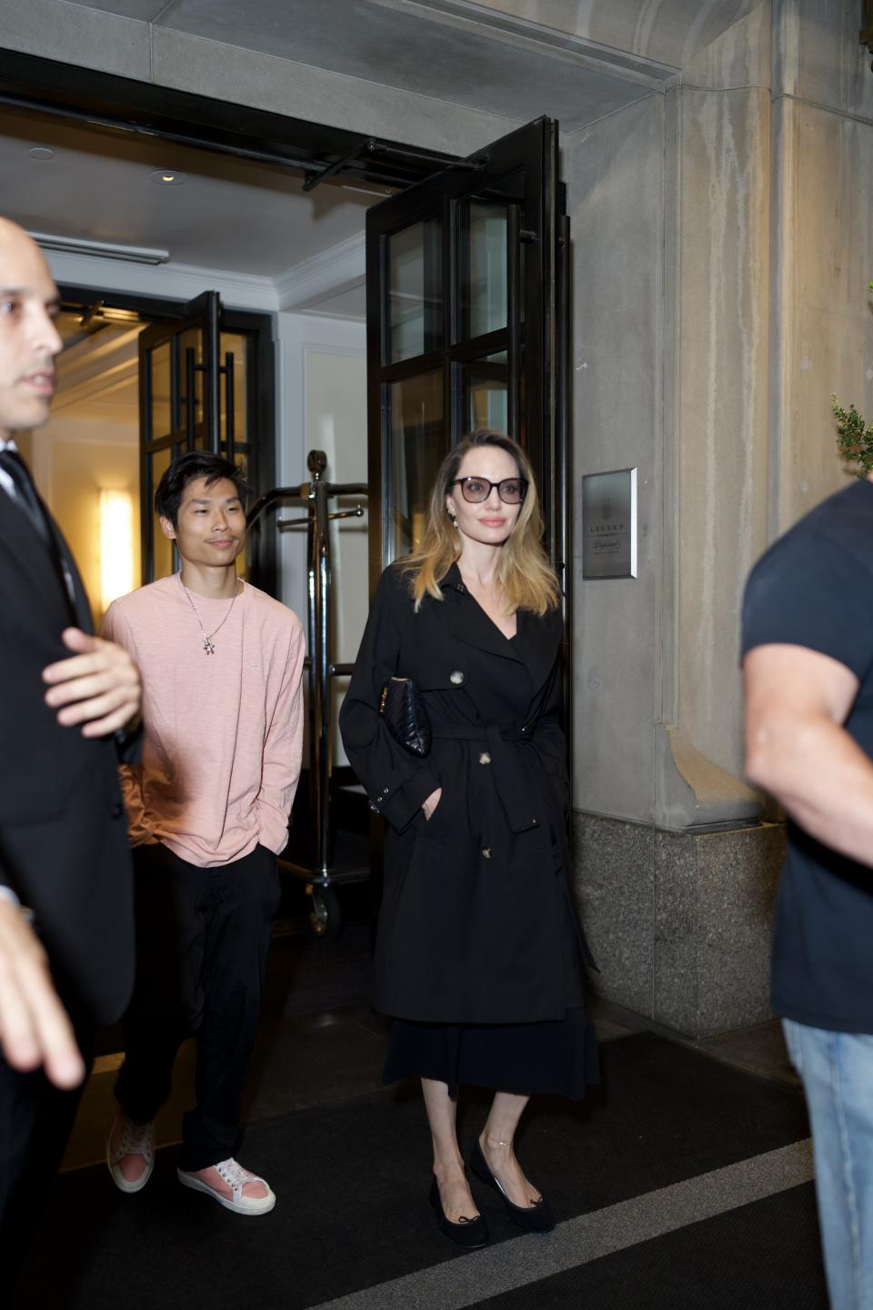 Pax Jolie-Pitt and his mother Angelina Jolie leaving their New York City hotel together