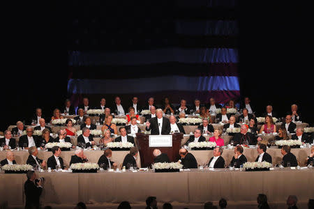 Republican U.S. presidential nominee Donald Trump (C) delivers remarks at the Alfred E. Smith Memorial Foundation dinner in New York, U.S. October 20, 2016. REUTERS/Jonathan Ernst