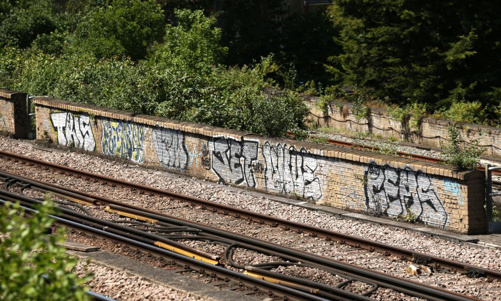 Graffiti on a railway line near Loughborough Junction railway station, south London.