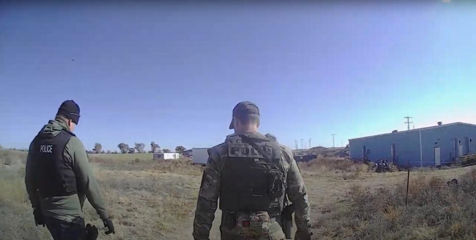 In this screengrab from a deputy's body-worn camera, Kingfisher County sheriff deputies and narcotics agents search a marijuana farm near Hennessey on Nov. 21, 2022, the day after a quadruple homicide.