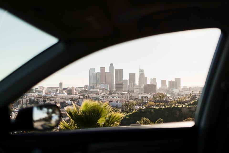 View of sunny cityscape out car window, Los Angeles, California