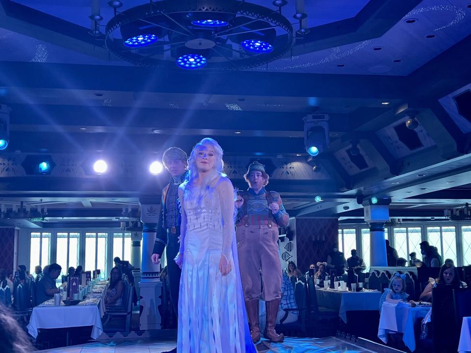 Elsa, Kristoff and Oaken address guests during dinner aboard the Disney Wish. (Photo: Terri Peters)