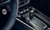 <p>In what appears to be a quick adaptation from the Panamera's layout with numerous haptic controls that surround the shifter (which we've found fussy to use), the 911 doesn't have any. But that leaves a large section of blank gloss-black plastic trim.</p>