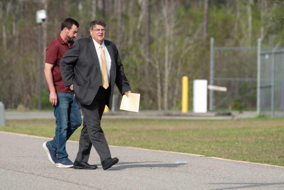 Alan Moran and his attorney, Donald Rafferty, walk into the Hancock County Jail in Bay St. Louis on Friday, March 3, 2023 as Moran surrenders himself following an indictment on felony charges for allegedly assaulting molesting a child and buying him beer.