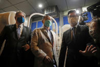 Hong Kong media tycoon and newspaper founder Jimmy Lai, center, walks out from a police station after being bailed out in Hong Kong, Wednesday, Aug. 12, 2020. The rounding up of the paper’s founder Jimmy Lai, the previous day and a raid on its headquarters have reinforced fears that a new national security law will be used to suppress dissent in Hong Kong after months of anti-government protests.(AP Photo/Kin Cheung)