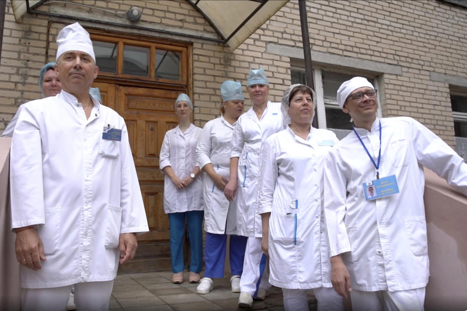 In this photo made from footage provided by the Russian Defense Ministry on Wednesday, July 15, 2020, medical workers look at volunteers participating in a trial of a coronavirus vaccine as they leave the Budenko Main Military Hospital outside Moscow, Russia. Russia is boasting that it’s about to be the first country to approve a COVID-19 vaccine, but scientists worldwide are sounding the alarm that the headlong rush could backfire. (Russian Defense Ministry Press Service via AP)