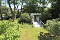 <p><span>1 Bonaventure Ave., St. John’s, Nfld.</span><br> The gardens are private and mature, and can be accessed from the walkout basement.<br> (Photo: Zoocasa) </p>