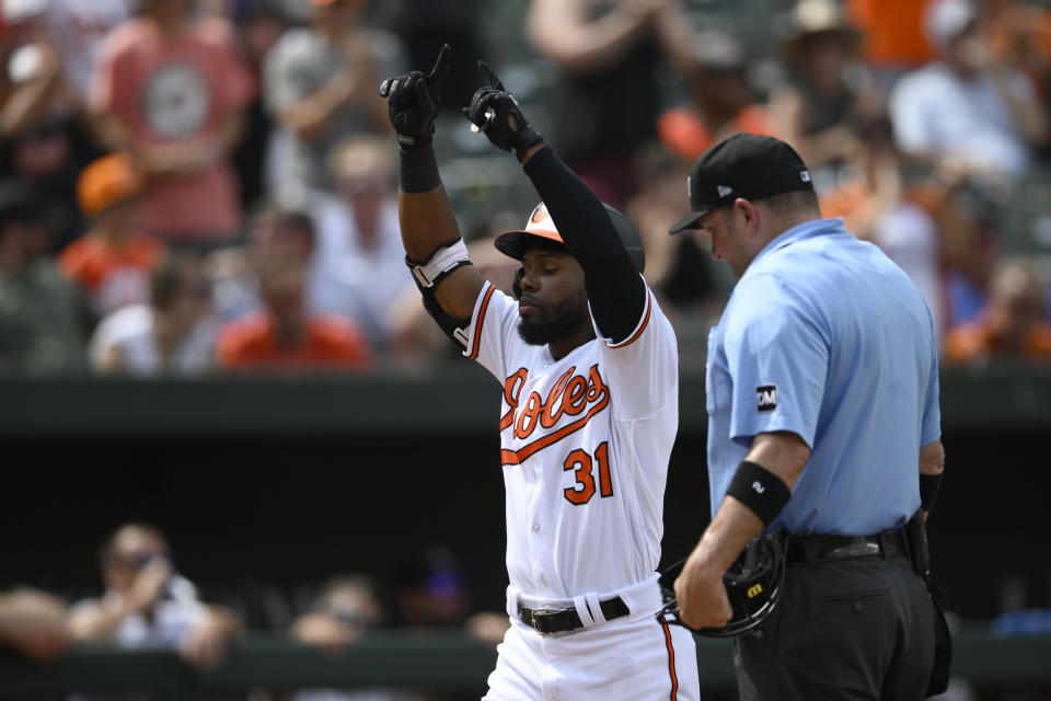 Baltimore Orioles' Cedric Mullins celebrates his home run during the fifth inning of a baseball game against the Colorado Rockies, Sunday, Aug. 27, 2023, in Baltimore. (AP Photo/Nick Wass)