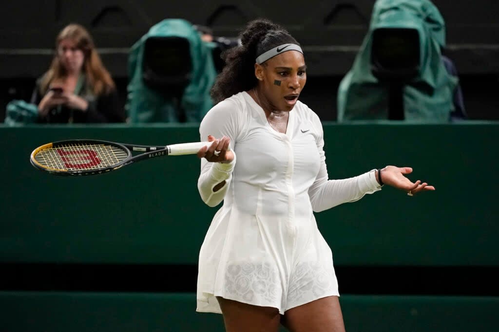 Serena Williams of the US reacts after losing a point as she plays France’s Harmony Tan in a first round women’s singles match on day two of the Wimbledon tennis championships in London, Tuesday, June 28, 2022. (AP Photo/Alberto Pezzali)