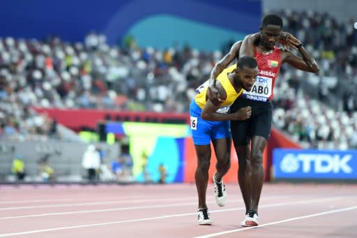 Helping hand of humanity -- Guinea-Bissau's Braima Suncar Dabo became an unlikely star when he stopped and helped toiling Aruban runner Jonathan Busby over 250 metres out to cross the line in the 5,000 metres