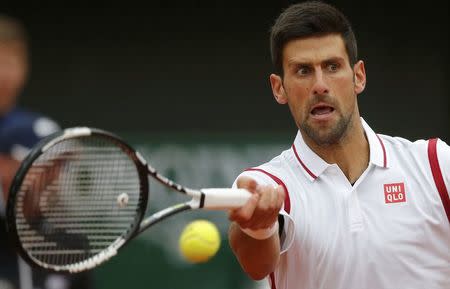 Tennis - French Open - Roland Garros - Novak Djokovic of Serbia v Roberto Bautista Agut of Spain - Paris, France - 31/05/16. Djokovic returns the ball. REUTERS/Gonzalo Fuentes