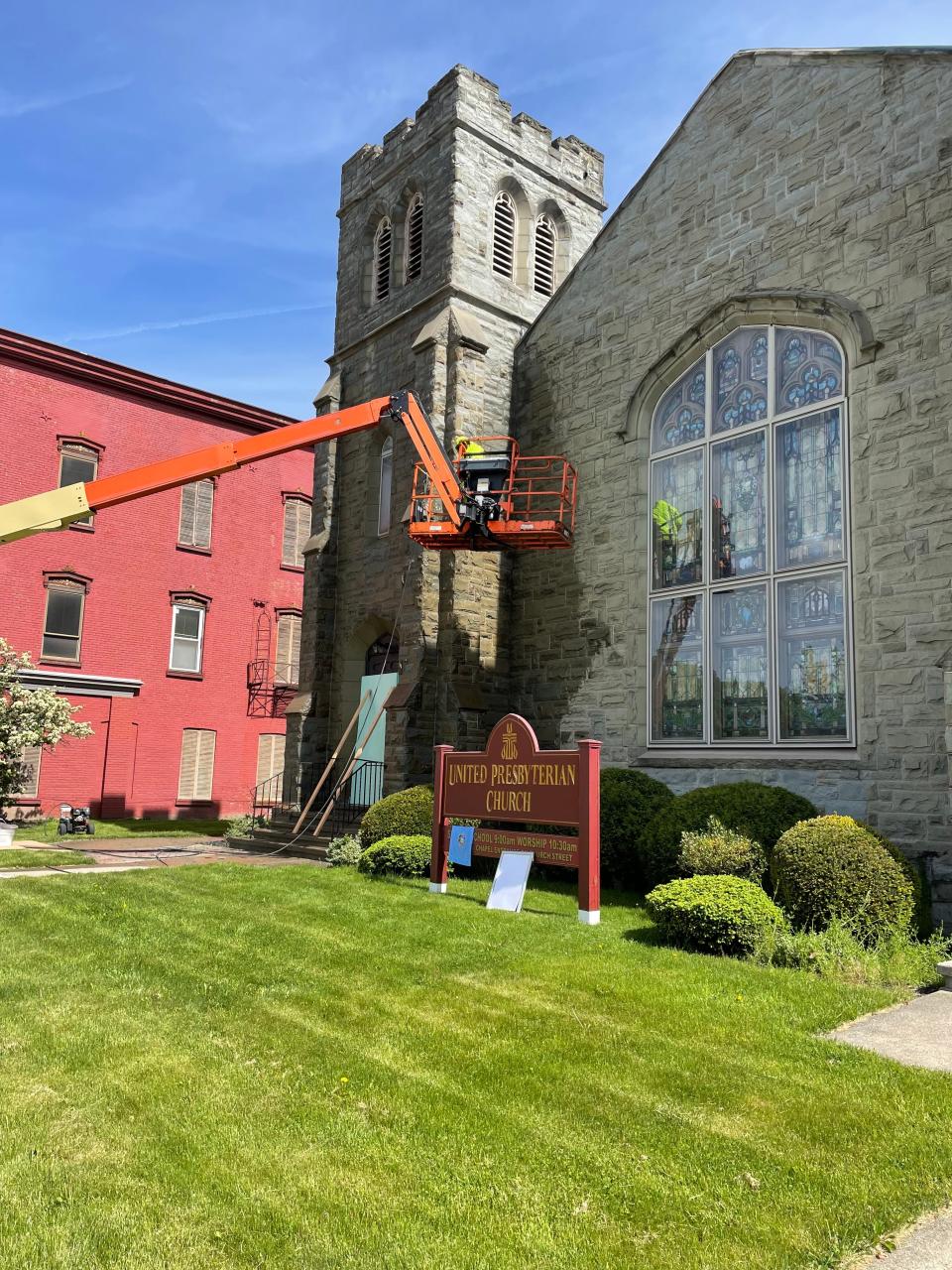 A building crew performs stonework restoration at the United Presbyterian Church of Hornell. The $250,000 project began in May 2022.