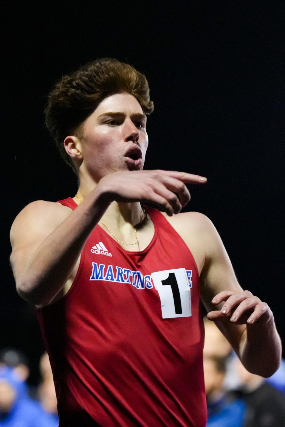 Martin Barco, of Martinsville High School, celebrates after winning the track and field boys heat 4 competition in the Miracle Mile race during the Flashes Showcase on Friday, April 12, 2024, at Franklin Central High School in Indianapolis. Martin Barco, of Martinsville High School, finished in first place with a time of 4:11.53. Cameron Todd, of Brebeuf Jesuit Preparatory School, finished with a time of 4:13.01. Roman Sierpina, of Louisville Collegiate School, finished in third place with a time of 4:14.44.