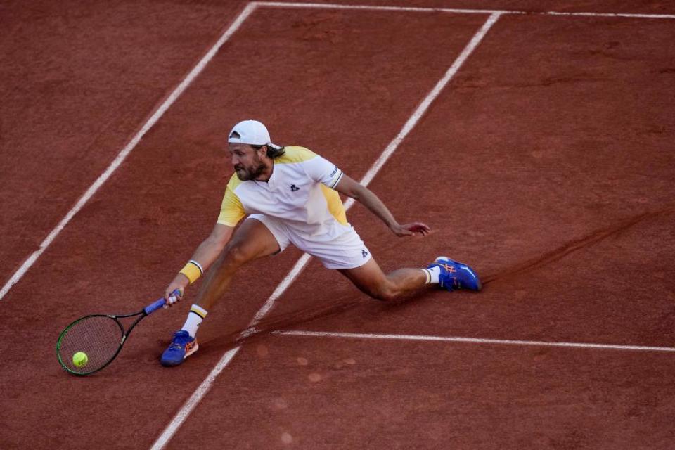 France's Lucas Pouille plays a shot against Britain's Cameron Norrie during their second round match at the French Open.