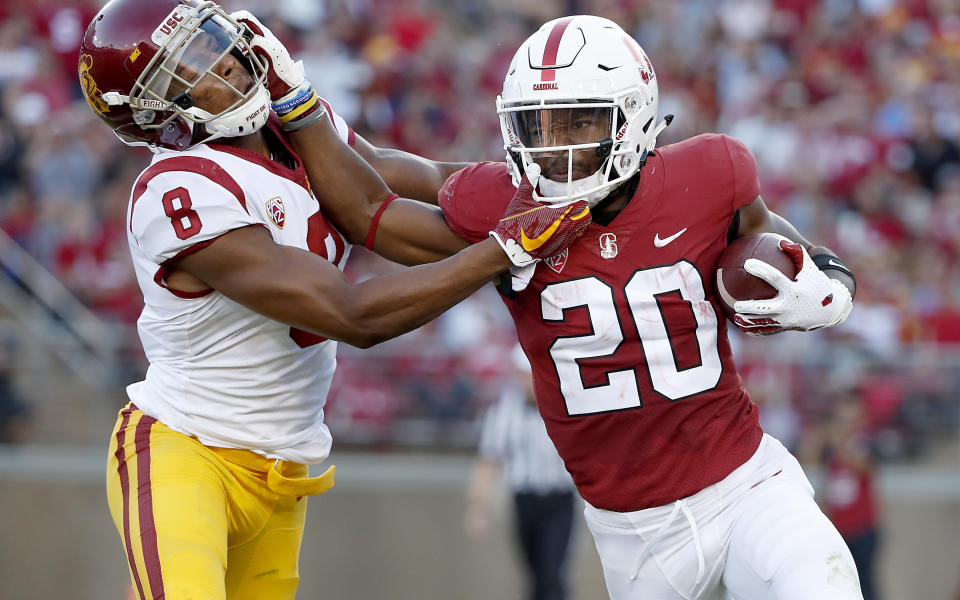 Stanford running back Bryce Love (R) stiff-arms Southern California cornerback Iman Marshall (8) during the first half of an NCAA college football game, Saturday, Sept. 8, 2018, in Stanford, Calif. (AP Photo)