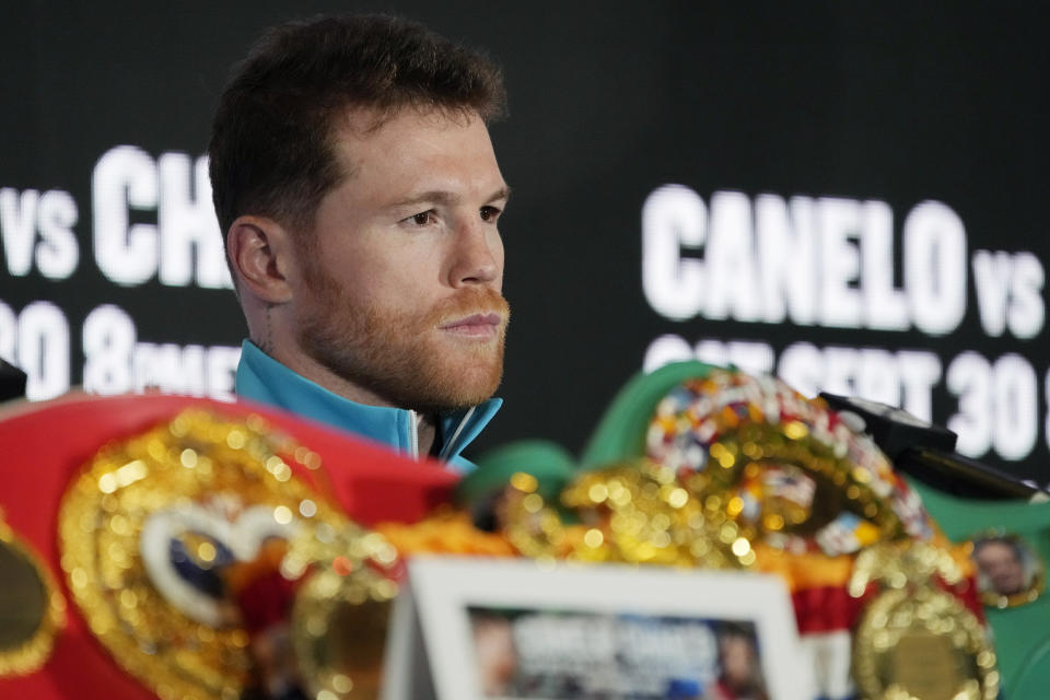 during a news conference Wednesday, Sept. 27, 2023, in Las Vegas. The two are scheduled to fight in a super middleweight title boxing match Saturday in Las Vegas. (AP Photo/John Locher)