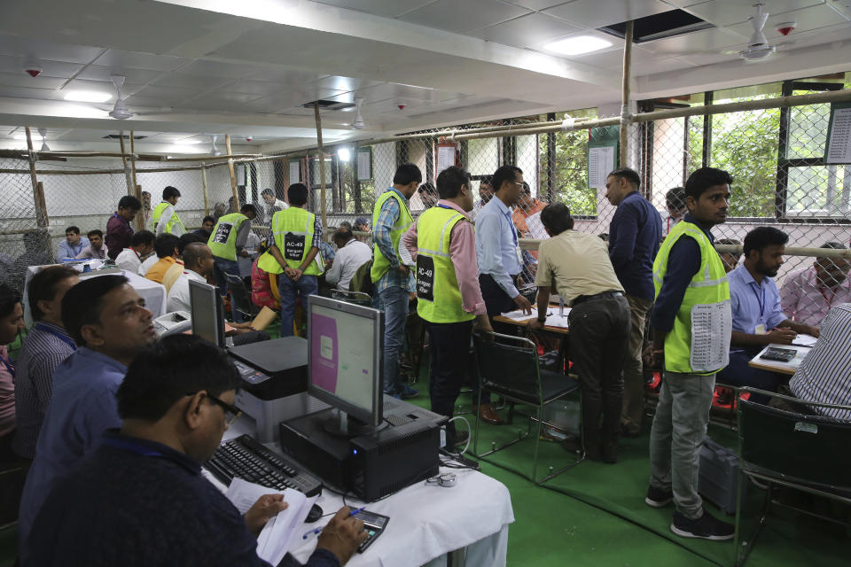 Election officials begin counting votes of India's massive general elections, in New Delhi, India, Thursday, May 23, 2019. The count is expected to conclude by the evening, with strong trends visible by midday. (AP Photo/Manish Swarup)