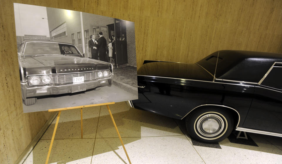 In this July 31, 2012 photo, a stretched Lincoln Continental used by Gov. Nelson Rockefeller sits on display on the concourse of the Empire State Plaza in Albany, N.Y. Historic artifacts that have been kept in storage for years are now on display in the corridors of the Capitol and the adjacent Empire State Plaza. (AP Photo/Tim Roske)