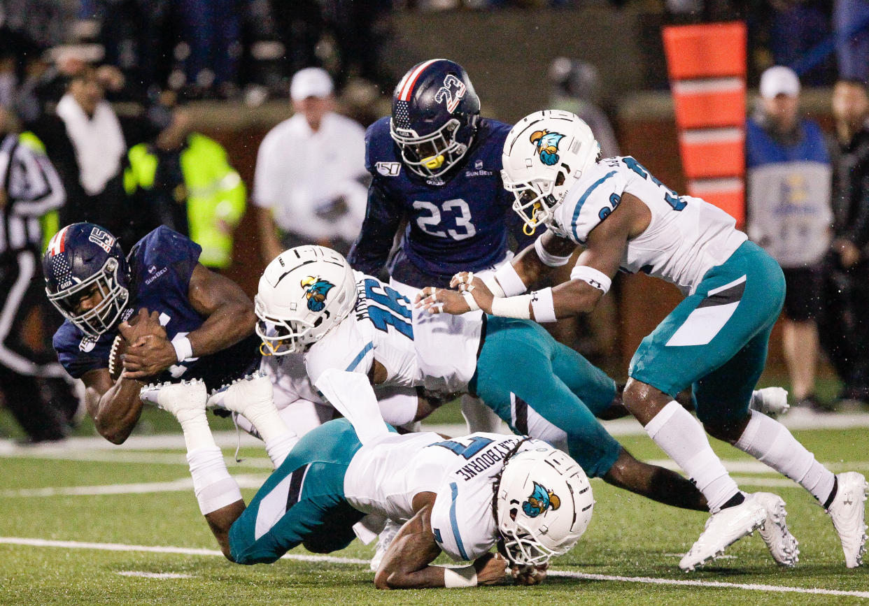 STATESBORO, GA - OCTOBER 19: J.D. King #15 of the Georgia Southern Eagles is brought down after a big gain in overtime by Jordan Morris #16 of the Coastal Carolina Chanticleers at Paulson Stadium on October 19, 2019 in Statesboro, Georgia. (Photo by Chris Thelen/Getty Images)