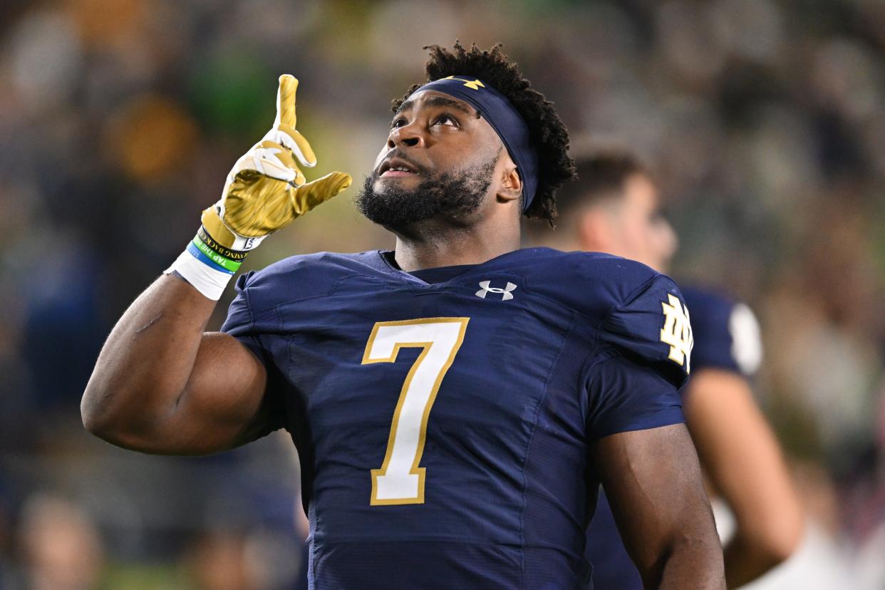 Oct 14, 2023; South Bend, Indiana, USA; Notre Dame Fighting Irish running back Audric Estime (7) gestures after running onto the field before the game against the USC Trojans at Notre Dame Stadium. Mandatory Credit: Matt Cashore-USA TODAY Sports