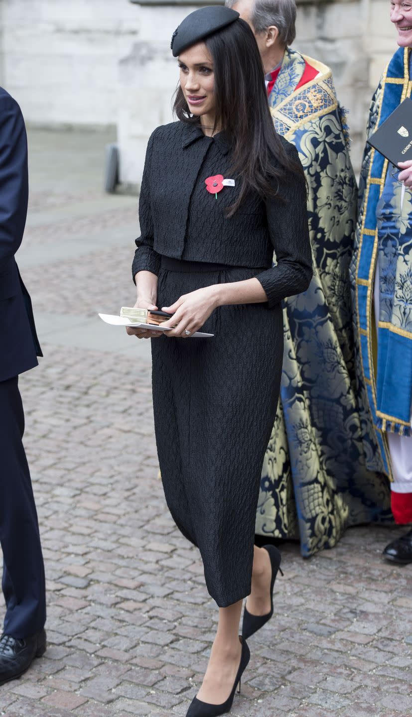 <p>Later on Anzac day, Markle looked timeless in a bespoke <a class="link " href="https://www.matchesfashion.com/womens/designers/emilia-wickstead" rel="nofollow noopener" target="_blank" data-ylk="slk:Emilia Wickstead;elm:context_link;itc:0;sec:content-canvas">Emilia Wickstead</a> black, jacquard midi skirt and cropped matching jacket at Westminster Abbey </p>